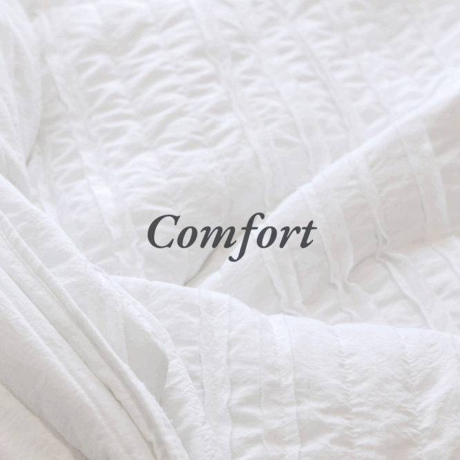 A picture of a blanket with a word on top that reads comfort