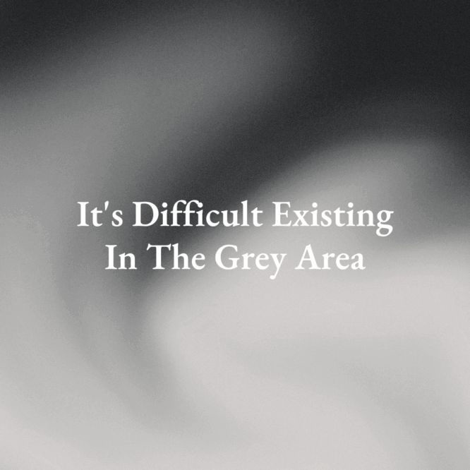 A text that reads It's Difficult Existing In The Grey Area over black grey and white colors